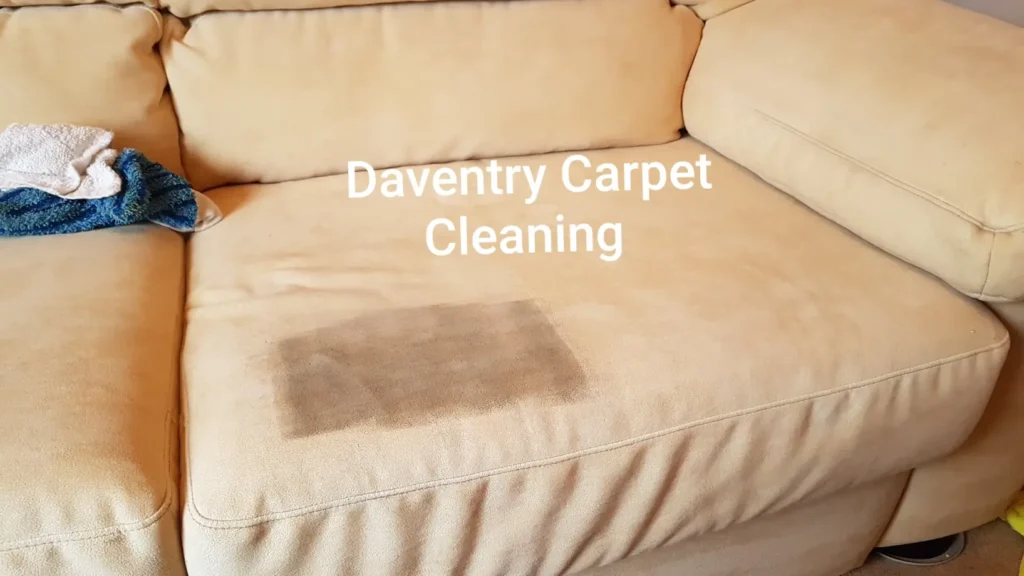 Dirty sofa almost cleaned by Daventry carpet cleaning